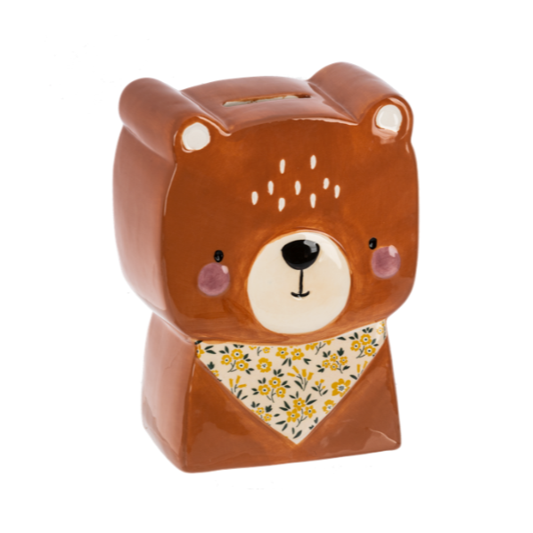 Bear-shaped ceramic piggy bank with a floral bandana on a white background